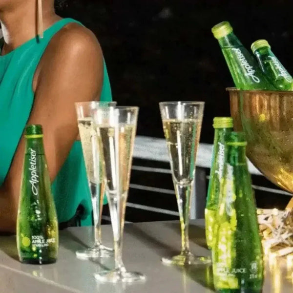 Appletiser bottles and glasses at a gathering