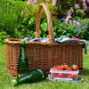 Appletiser bottles beside a picnic basket