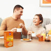 Couple enjoying tea with Bakers Ginger Nuts Ginger & Golden Syrup Flavour Rusks on the table.