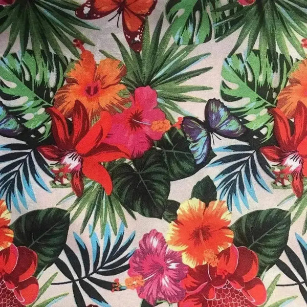 Beige tablecloth with vibrant tropical flowers on a dining table