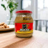 Black Cat Smooth Peanut Butter 400g jar on a kitchen table
