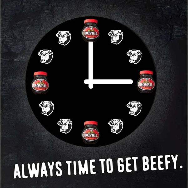 Black clock with Bovril jars and cow icons as hour markers and text "Always time to get beefy" promoting Bovril beef and yeast extract.