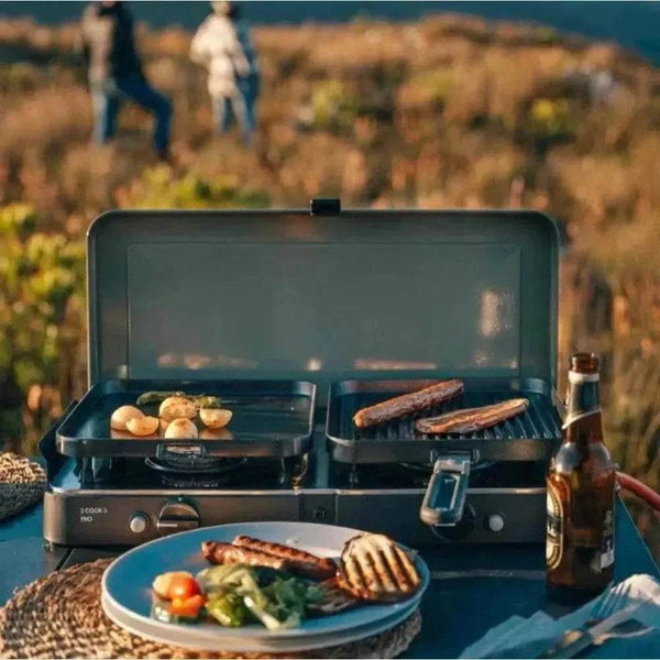 Portable CADAC 2 Cook 3 Pro gas barbecue with dual burners and flat and ribbed GreenGrill plates for versatile outdoor cooking