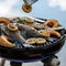 CADAC Carri Chef 50 BBQ grilling fish and vegetables outdoors.