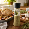 Cape Herb & Spice Garlic & Herb 270g seasoning shaker beside roast chicken and vegetables
