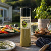 Cape Herb & Spice Garlic & Herb 270g shaker at an outdoor barbeque meal