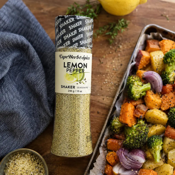 Cape Herb & Spice Lemon Pepper Shaker 290g beside roasted vegetables in a food preparation scene