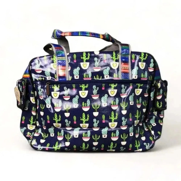 Cotton Road Nappy Bag in navy blue with cactus and stripes design, multiple compartments, and long strap
