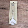 Enamel sugar spoon with wooden handle and farmhouse flower engraving