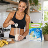 Adult preparing a Futurelife High Protein Vanilla meal replacement shake