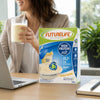 Futurelife High Protein Vanilla 500g with a prepared shake at an office desk
