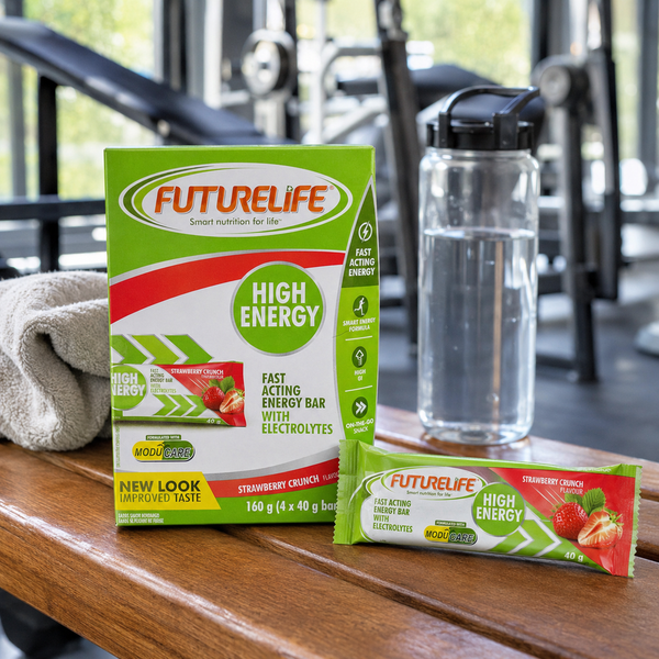 Futurelife High Energy Strawberry Crunch bars with water bottle and towel on an adult gym bench