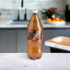 Stoney Ginger Beer 2-litre bottle on kitchen counter, known for strong ginger flavor.