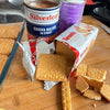 Silverleaf Guava Halves in Syrup can with biscuits and evaporated milk on a wooden table.