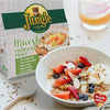 Jungle Muesli Tropical 750g package with fruit and nuts in a bowl.