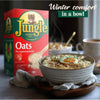 Jungle Oats 1kg box next to steaming bowl of oatmeal, highlighting winter comfort and nourishment.