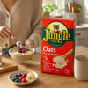 Jungle Oats 1kg wholegrain rolled oats with a warm breakfast bowl, banana and berries