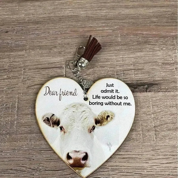 Wooden heart key tag with brown tassel and laser cut design