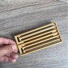 Medium gold plastic Koeksister cutter for shaping traditional Afrikaans fried dough confectionery