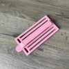 Pink medium-sized koeksister cutter made of durable plastic for easy dough shaping and braiding