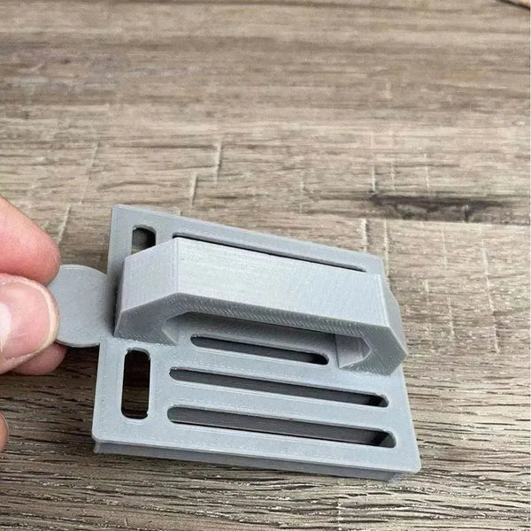 Small grey plastic Koeksister cutter for traditional braided dough pastries