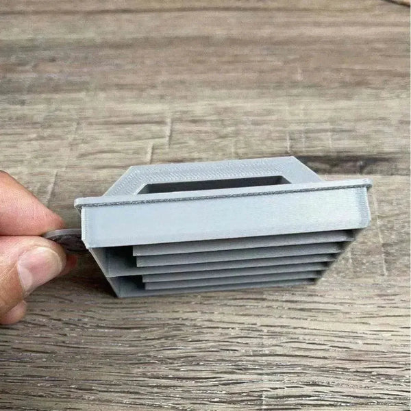 Small grey plastic Koeksister Cutter for traditional Afrikaans braided dough shaping