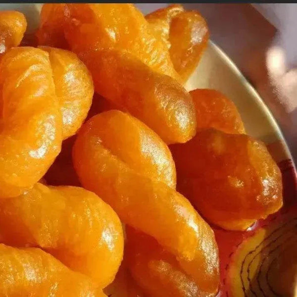 Pack of 12 freshly made Koeksisters ready to eat, golden fried dough soaked in sweet syrup, South African treat for weekend sharing and events