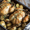 Ina Paarman Lemon & Herb Coat & Cook Sauce with roasted chicken and vegetables.