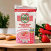 ACE Instant Maize Porridge (Strawberry) 1kg pack on a wooden table with strawberries; nutritious breakfast option.