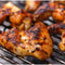 Grilled chicken marinated with All Joy Marinade Chicken on a grill.