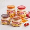 Melrose Cheese Spread - Bacon 400g jars displayed with other flavors and tomatoes.