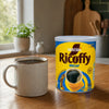 Nescafé Ricoffy Decaf 250g tin beside a fresh cup of black coffee