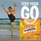 Bokomo ProNutro Original 500g cereal box on beach background with woman stretching, promoting nutritious breakfast.