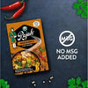 Rajah Curry Powder Mild & Spicy 100g pack on dark background with red chilies and herbs.