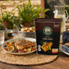 Robertsons Fish Spice 1kg with grilled fish and vegetables outdoors