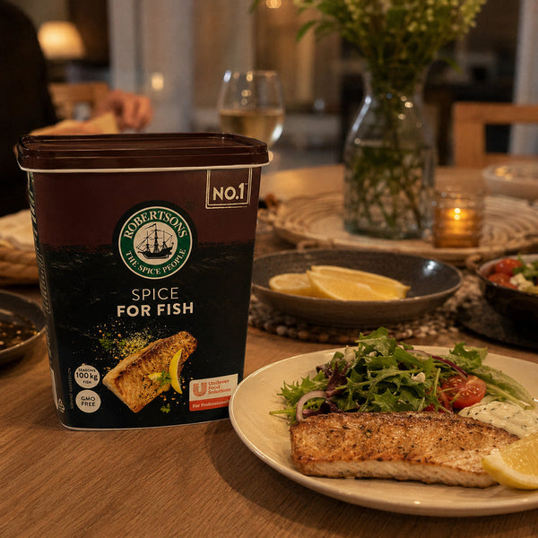 Robertsons Fish Spice 1kg beside a plated fish dinner