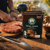 Robertsons Steak & Chops Spice 1kg at an outdoor braai with seasoned steaks