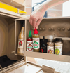 Rooibaard Tabaardsco Groen Sauce 250ml in cupboard with other seasonings.