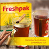 Freshpak Rooibos Tea 80's box with two cups of tea and cinnamon sticks on a wooden surface.