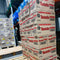 Bakers Tennis Classic Coconut Rusks 450g boxes stacked in a warehouse.