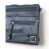 Black PU leather sling bag with adjustable strap and multiple zip compartments