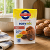 Snowflake Bran Muffin Mix 500g with freshly baked bran muffins on a kitchen counter