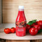 Wimpy Tomato Sauce 500ml bottle surrounded by fresh tomatoes on a wooden surface.