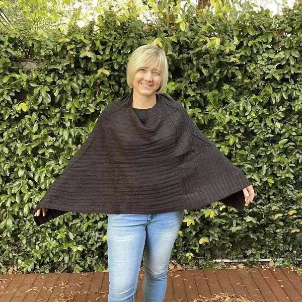 Black knitted cotton winter poncho with round neck