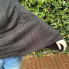 Black knitted cotton winter poncho with round neck