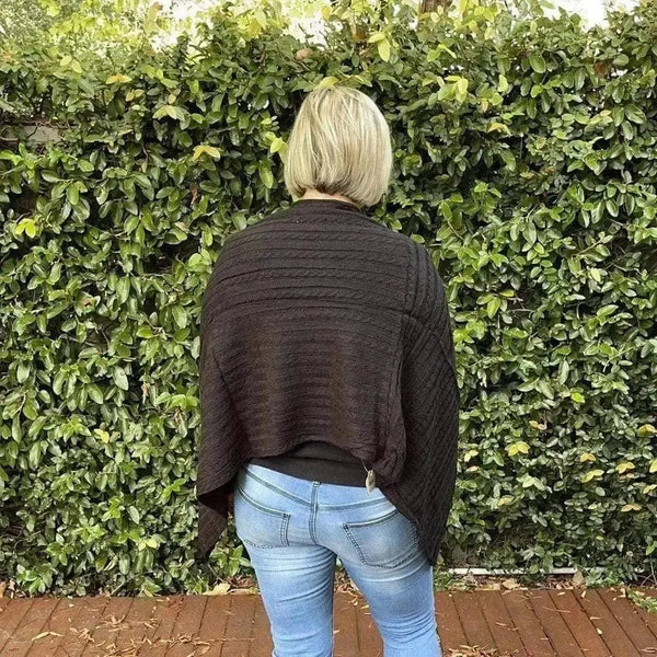 Black knitted winter poncho with round neck cotton road design