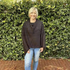 Black knitted winter poncho with round neck cotton road design