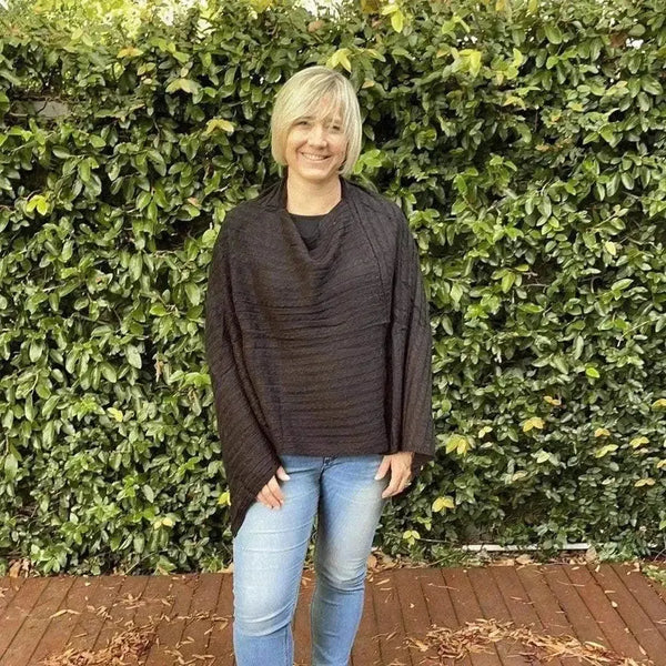 Black knitted winter poncho with round neck cotton road design