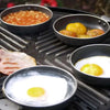 CADAC Tapas set of 4 pans on grill with eggs, beans, and bacon cooking.