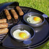 CADAC Tapas set of 4 pans on BBQ grill with sausages and eggs cooking.